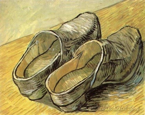 A Pair Of Leather Clogs